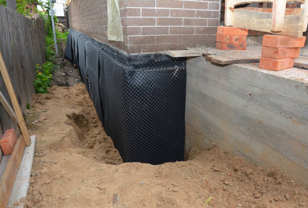 Happy homeowners after waterproofing job in Stapleton